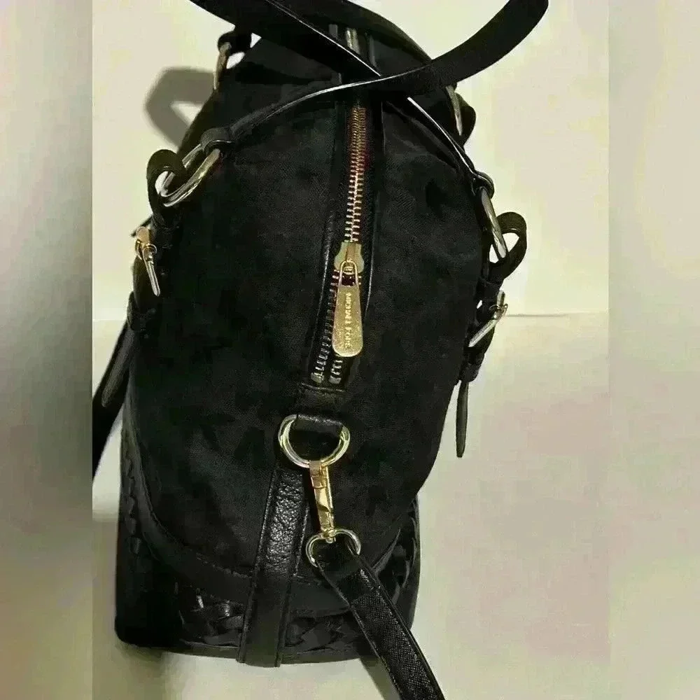 A Mickael Kors black Gladstone satchel with gold tone hardware.